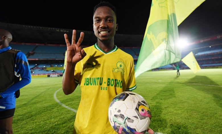 Cassius Mailula poses with a match ball after scoring a hat trick