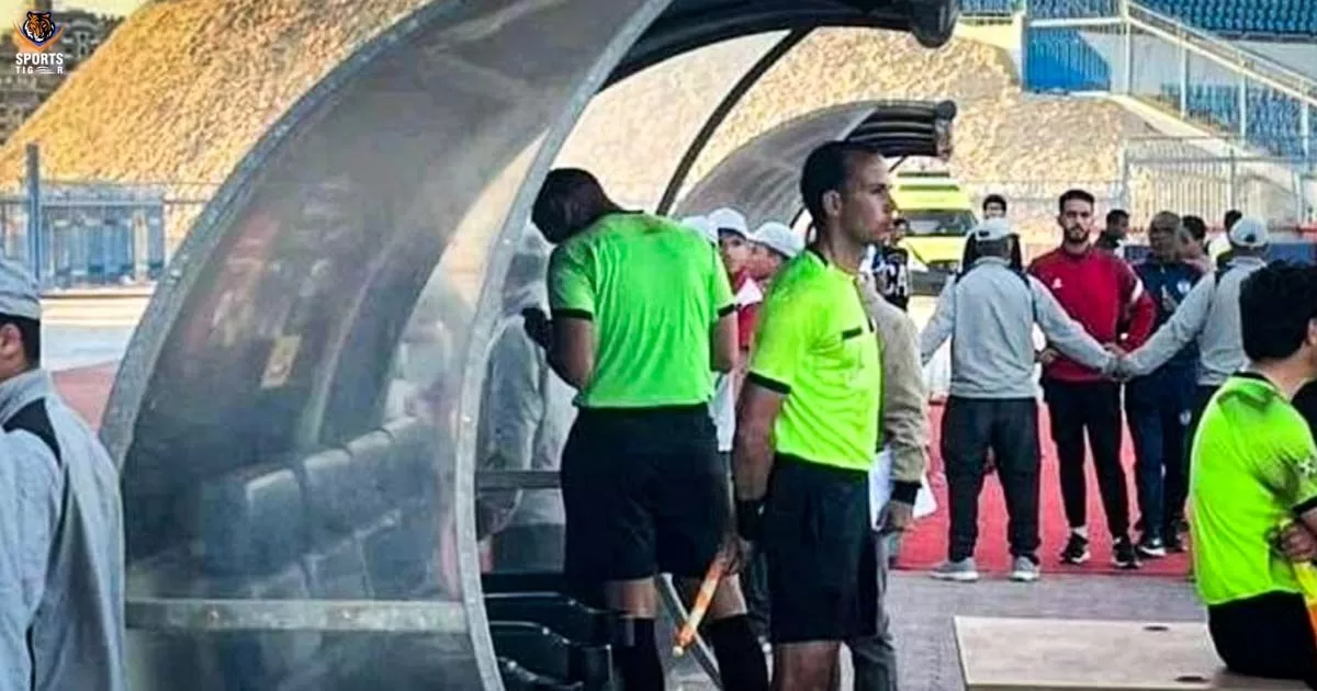 Mohamed Farouk watching a footage on a fan’s mobile phone