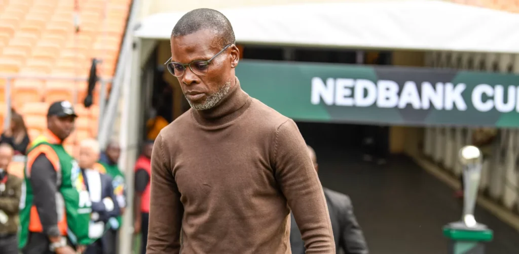 Arthur Zwane walking to the bench before a game.