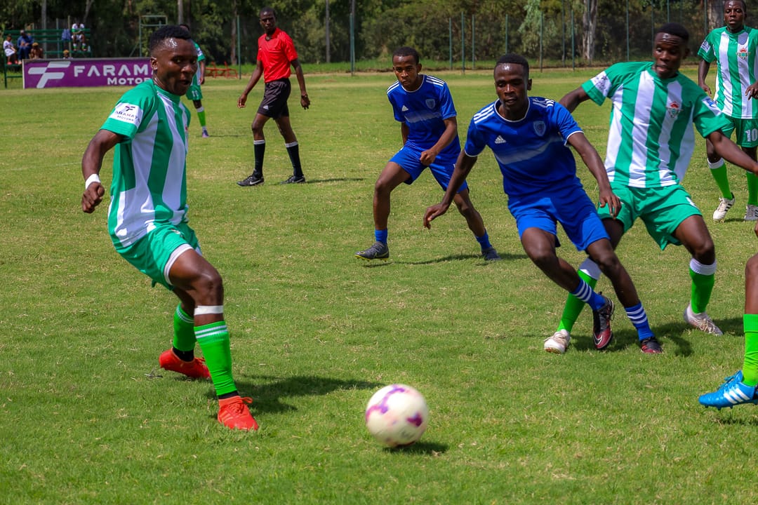 Real Betis Academy players [In green and White] in action