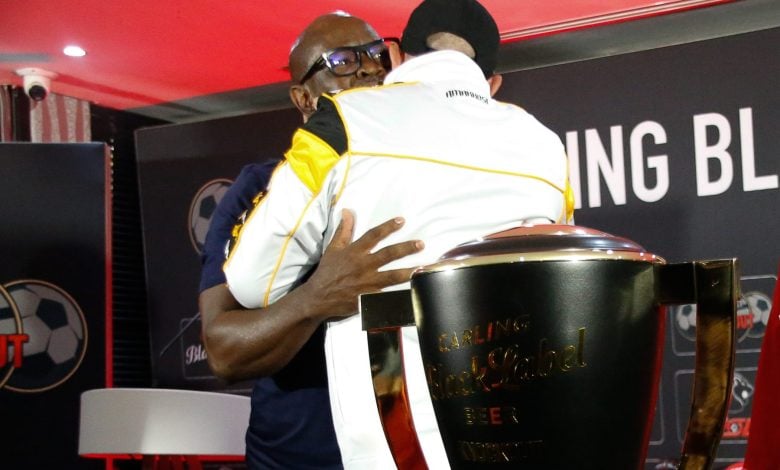 Nasreddine Nabi and Steve Khompela hugging after a press conference