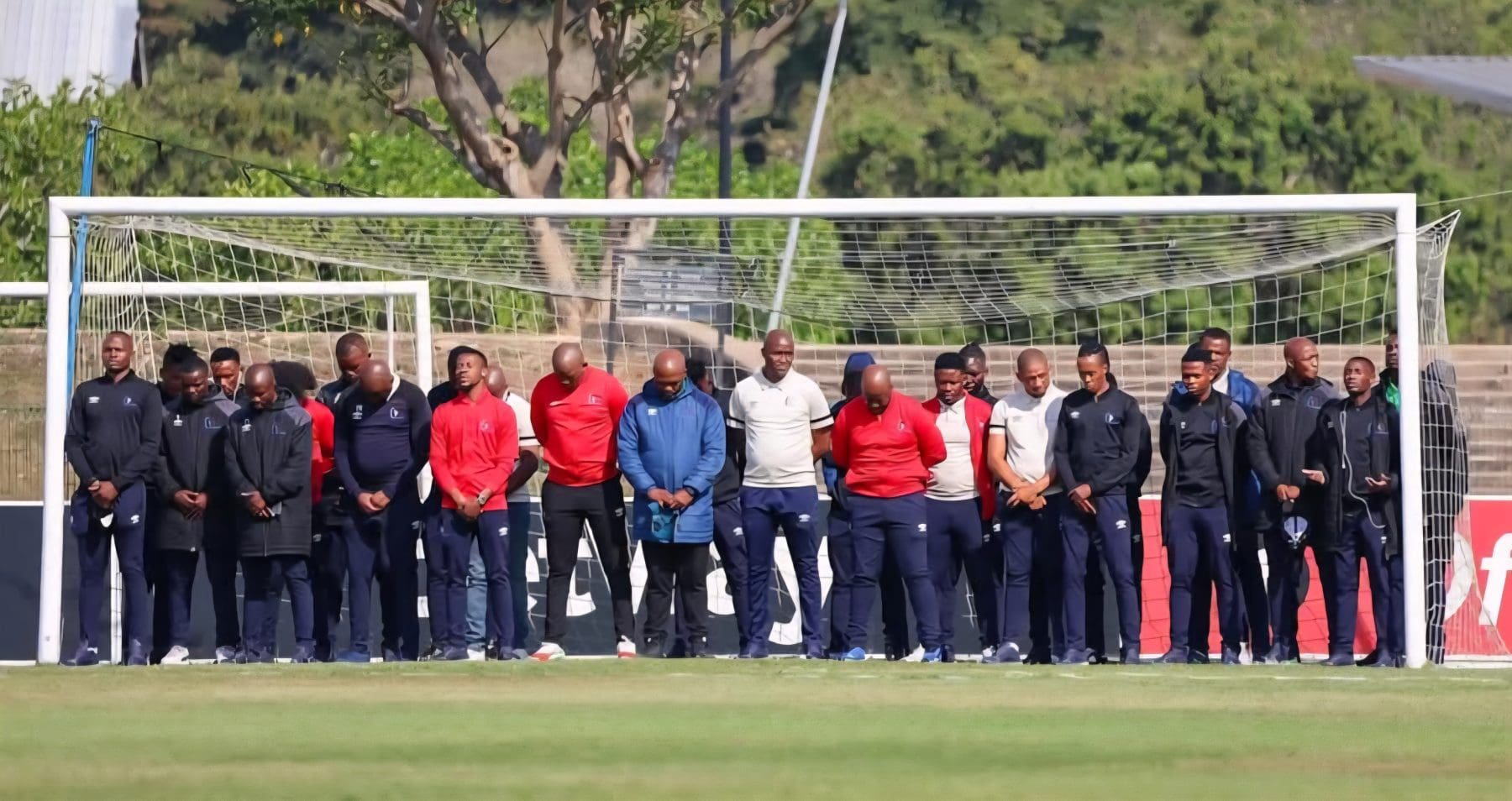 Orbit College FC players standing in the goal post before a match
