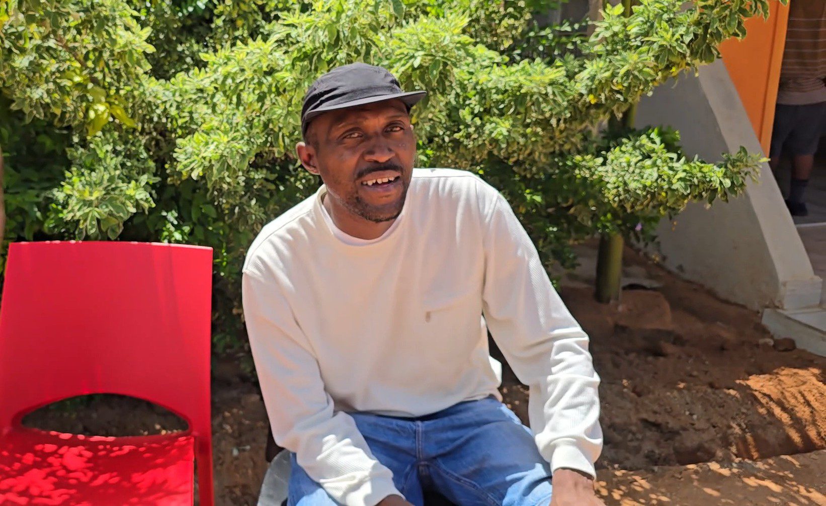 Lerato Chabangu sitting on a chair at the Hope of Achievers Rehabilitation Centre outside Polokwane.