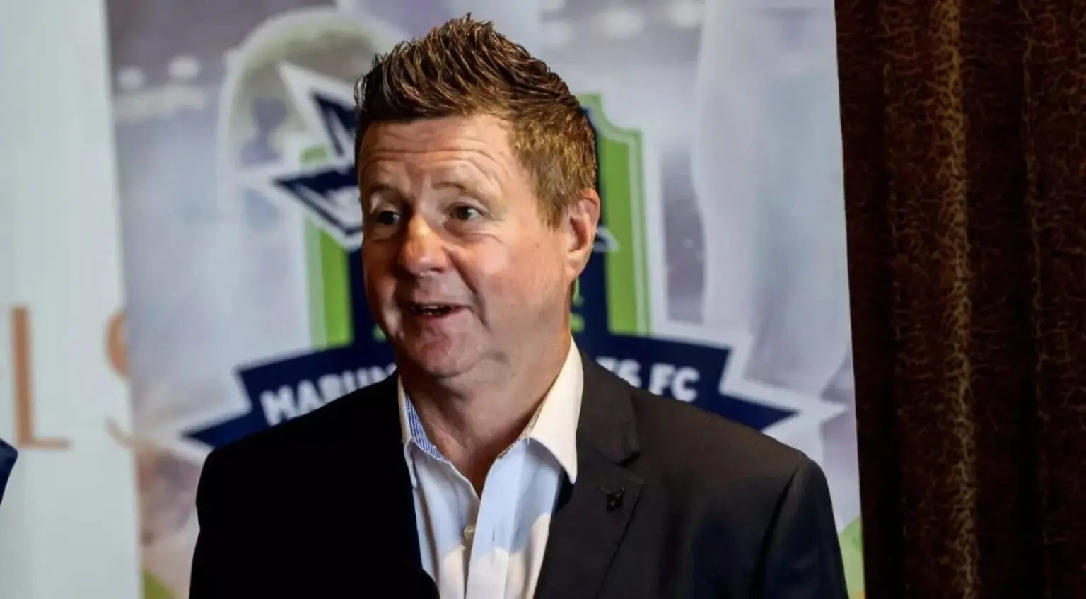 Dylan Kerr addressing members of the media