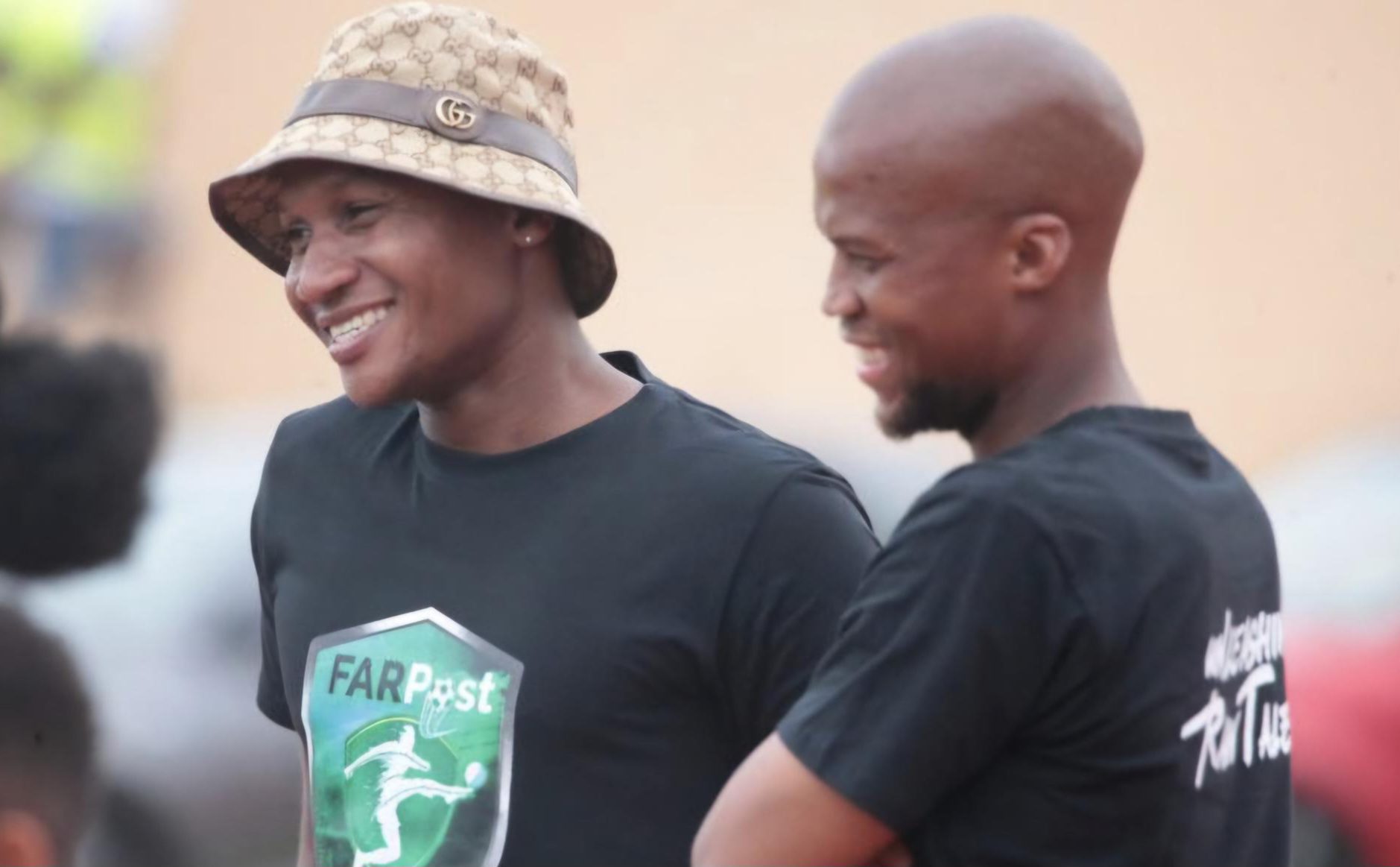 Jackson Mabokgwane and Tshepo Gumede having a conversation during a FARPost Cup tournament