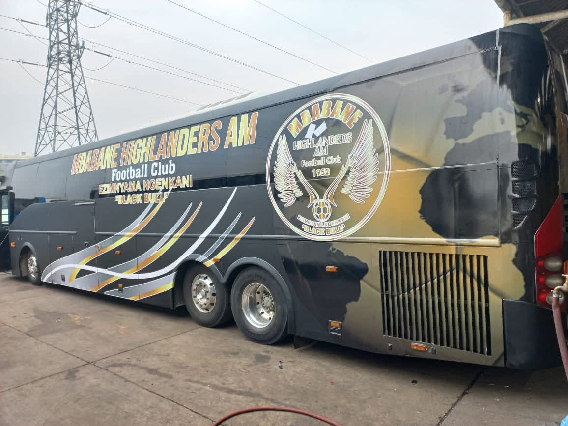 The Mbabane Highlanders AM Bus parked outside a stadium 