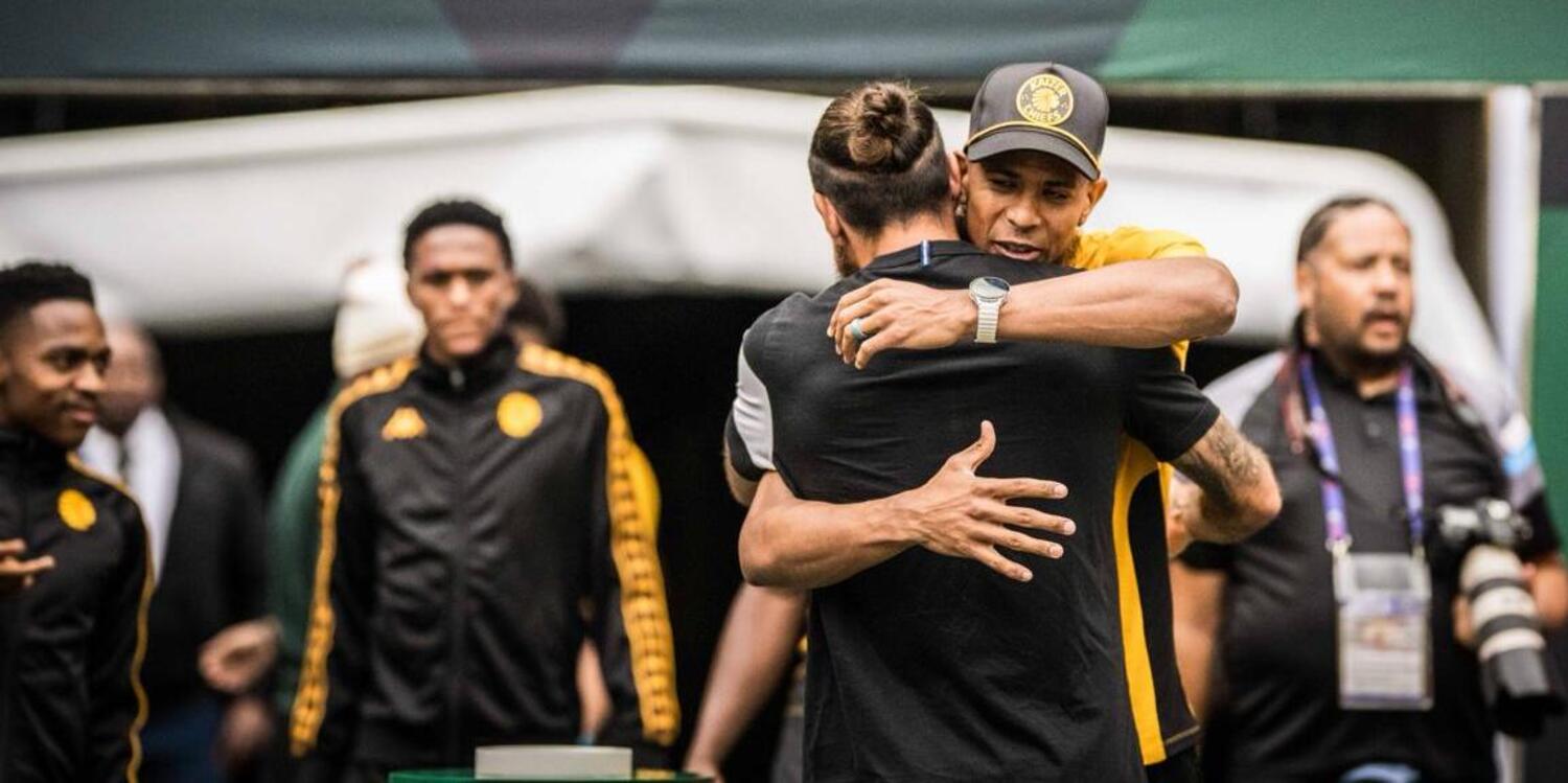 Brandon Petersen of Kaizer Chiefs embraces Stellenbosch FC goalkeeper Sage Stevens