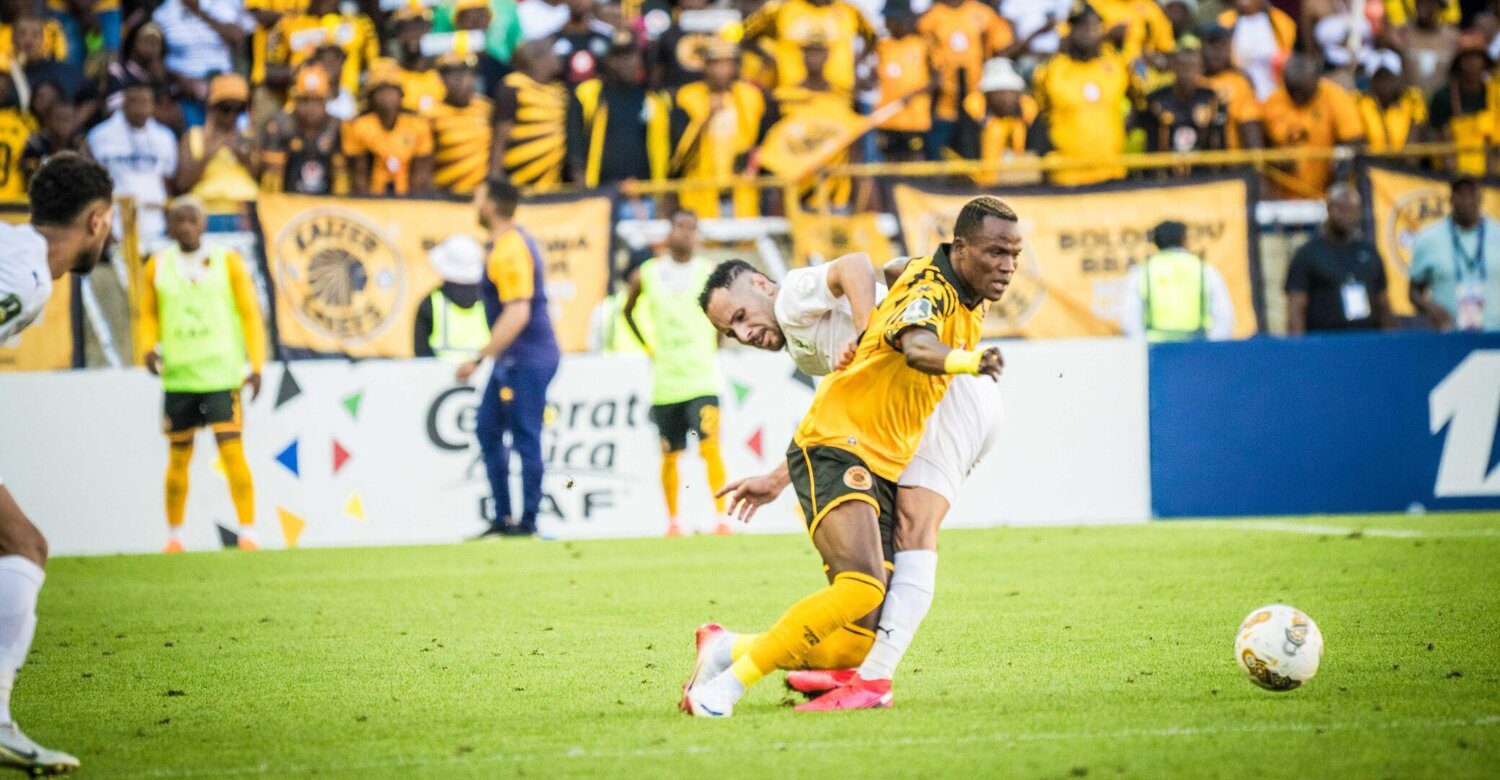 Kaizer Chiefs striker Glody Lipo goes down under the challenge of an AL Masry player