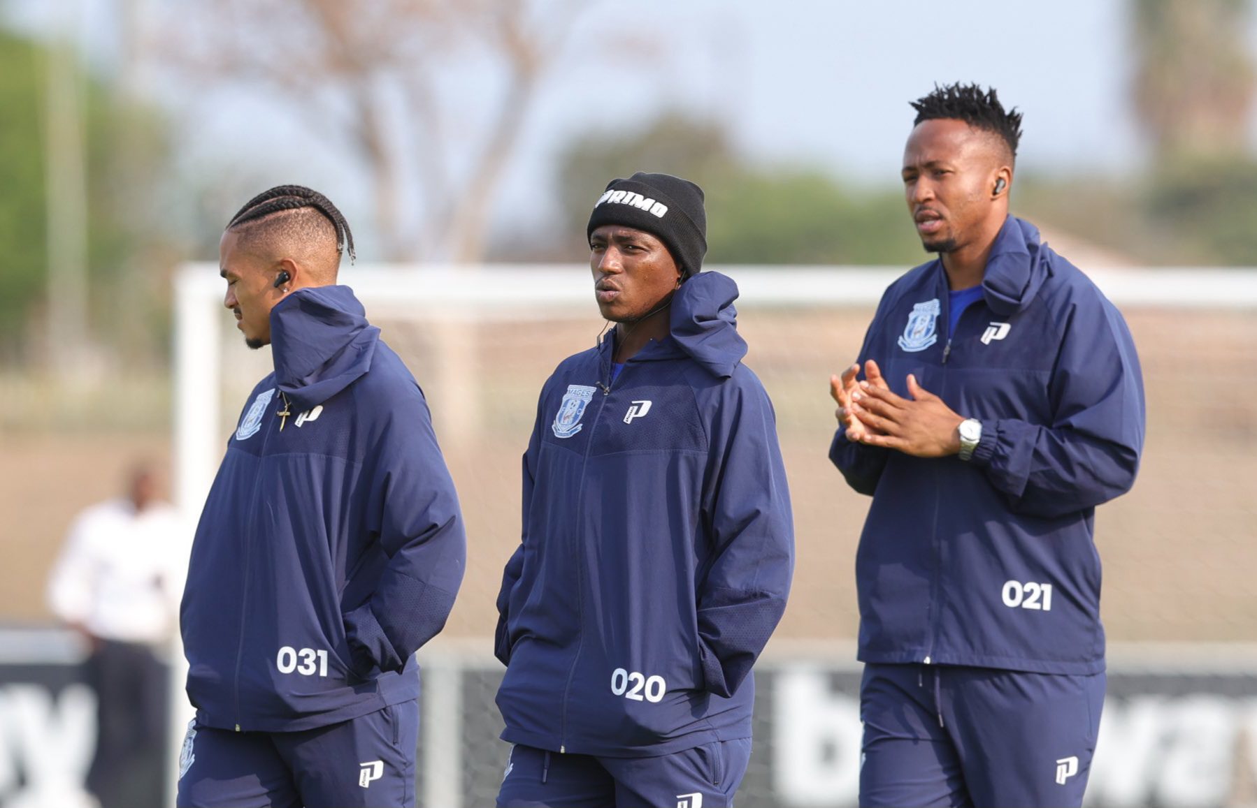 Magesi FC players doing a pitch inspection at the Seshego Stadium