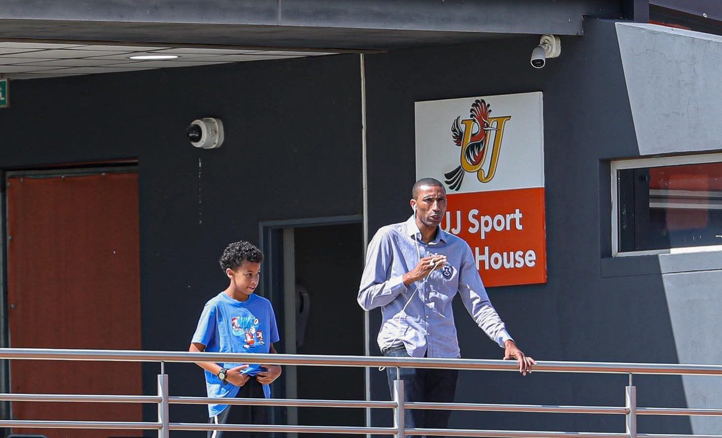 Abdeslam Ouaddou with his son at UJ Soweto Campus attending Orlando Pirates v Golden Arrows DDC match
