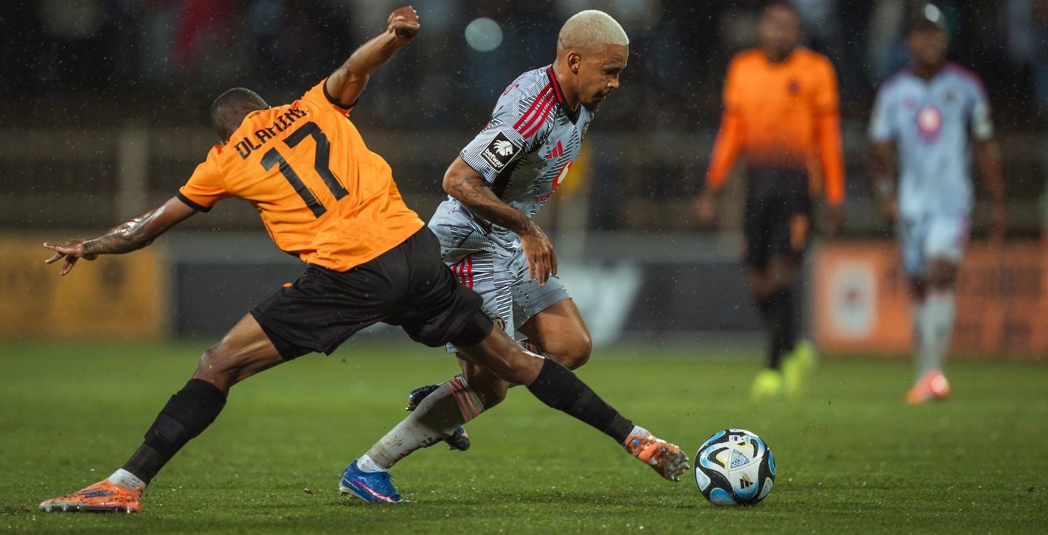Bonginkosi Dlamini of Polokwane City FC tries to win the ball from Orlando Pirates winger Oswin Appollis