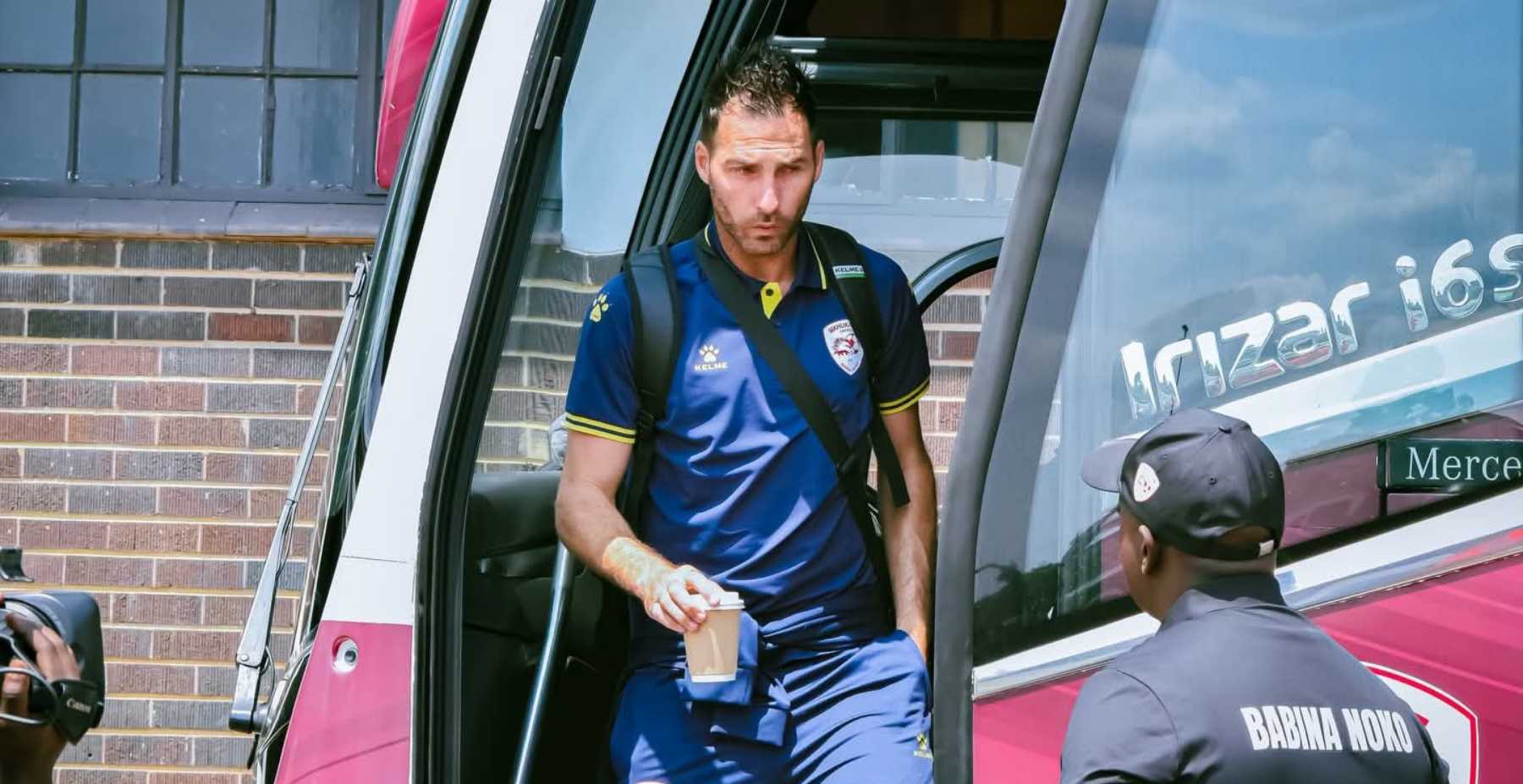 Bradley Grobler walking out of a team bus before a League match for Sekhukhune United.