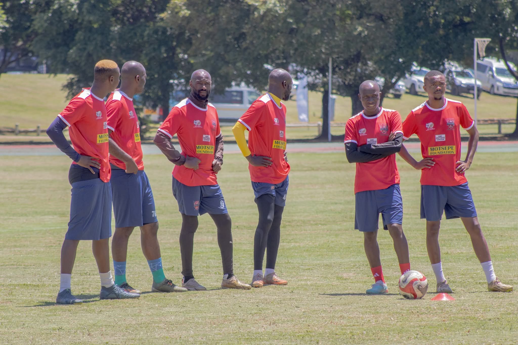 Gomora United players standing during a club training session