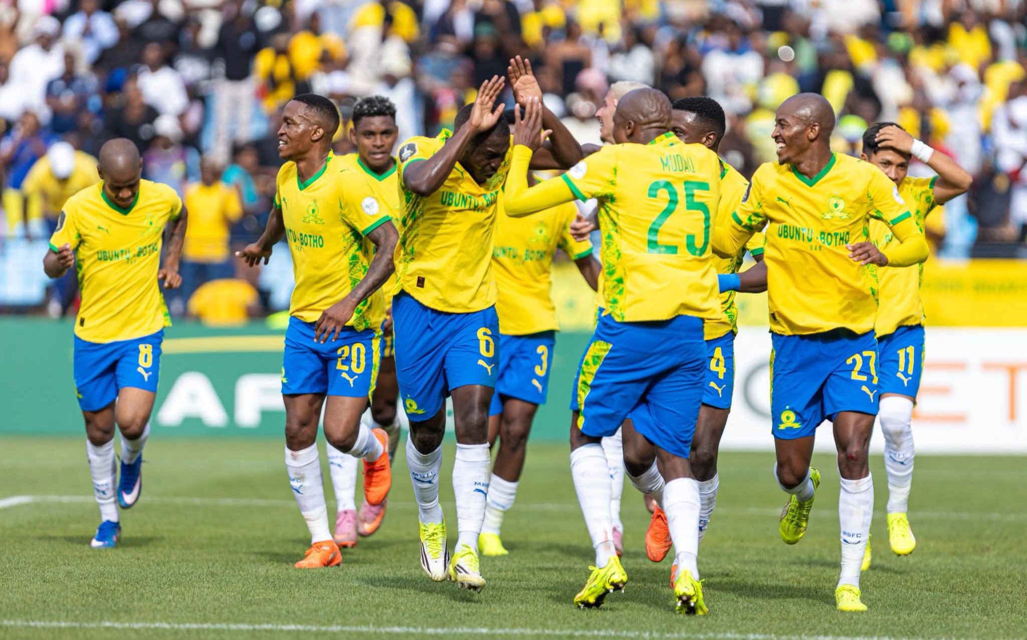 Mamelodi Sundowns players celebrating during a CAF Champions League match against MC Alger.