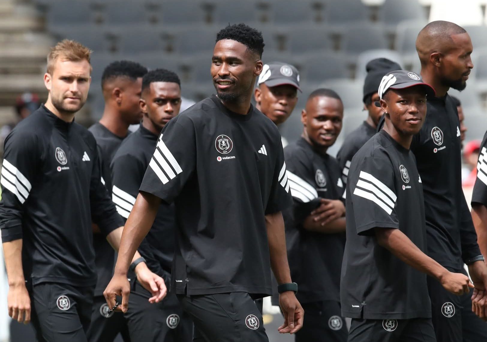 Sipho Chaine doing a pitch inspection with his Orlando Pirates teammates 