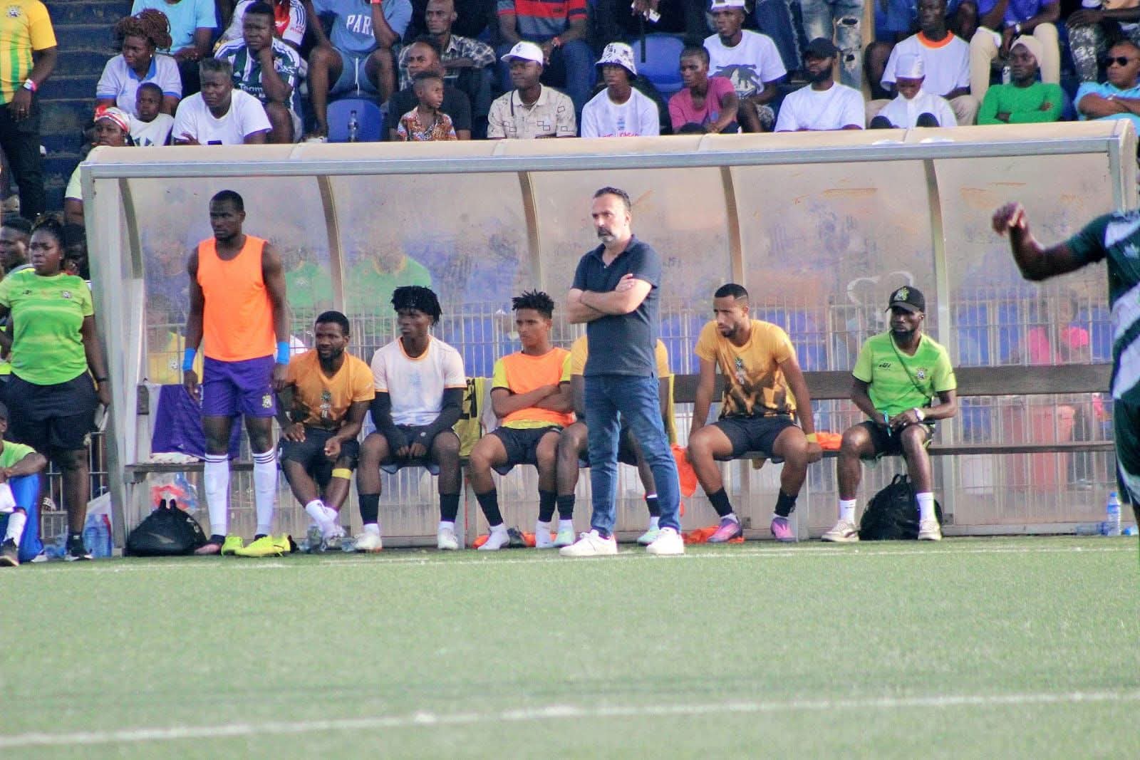 Fabio Lopez on the bench for FC Fassell in Liberia.