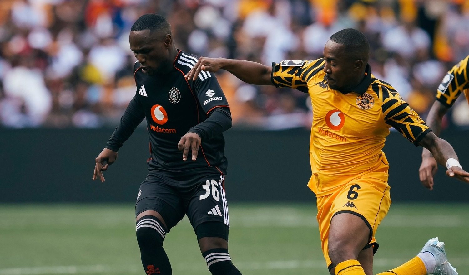 Kamogelo Sebeleble dribbling the balll away from Lebohang Maboe during the Soweto Derby between Kaizer Chiefs and Orlando Pirates