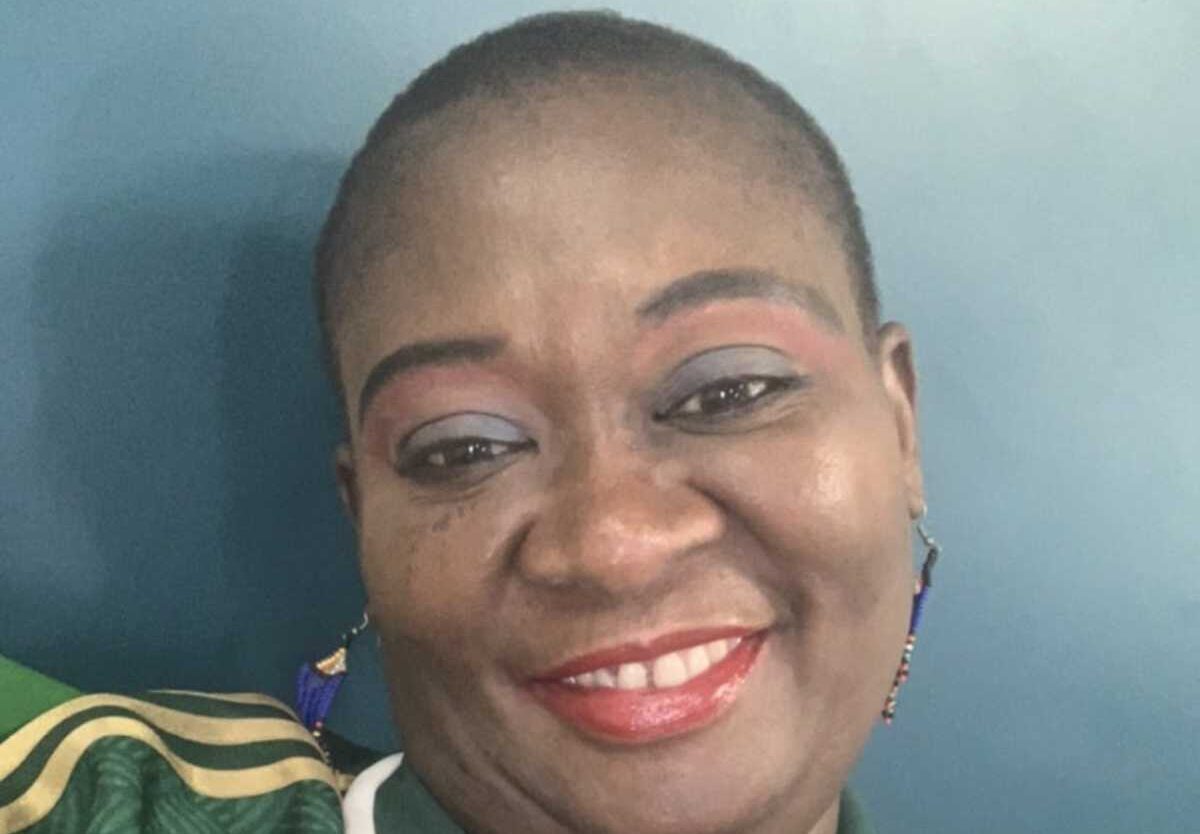 Mama Joy wearing the new away Bafana Bafana jersey