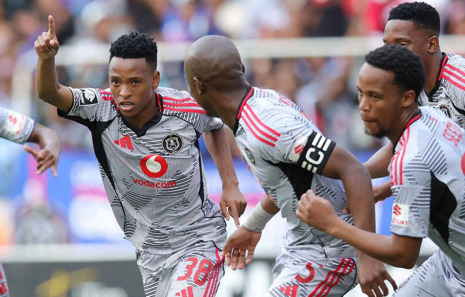 Orlando Pirates captain Nkosinathi Sibisi and Lebone Seema join in celebrating Relebohile Mofokeng's goal