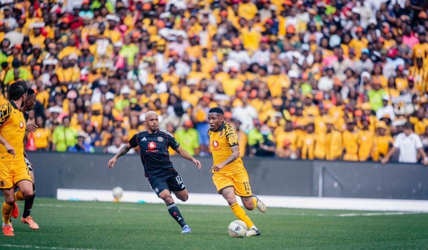 Oswin Appollis of Orlando Pirates marking the ball from Kaizer Chiefs winger Pule Mmodi