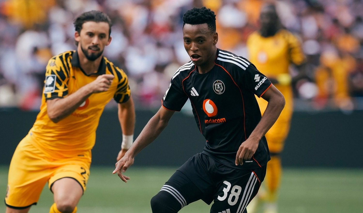Orlando Pirates star Relebohile Mofokeng being tracked by Ethan Chislett of Kaizer Chiefs