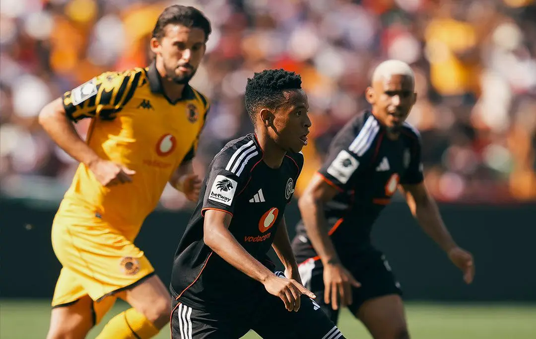 Orlando Pirates' Relebohile Mofokeng dribbles the ball past Ethan Chislett of Kaizer Chiefs