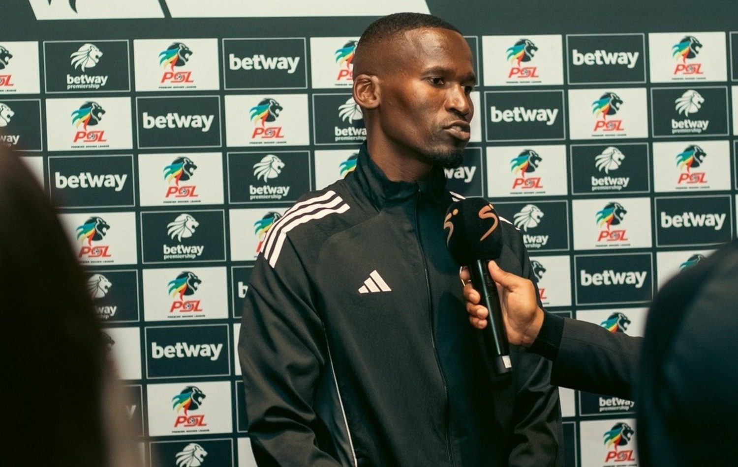 Orlando Pirates defender Tapelo Xoki addressing the media