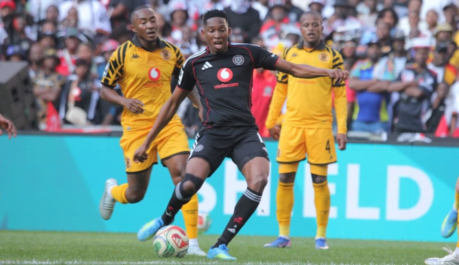 Orlando Pirates midfielder Thalente Mbatha shoots while being tracked by Kaizer Chiefs midfielder Lebohang Maboe