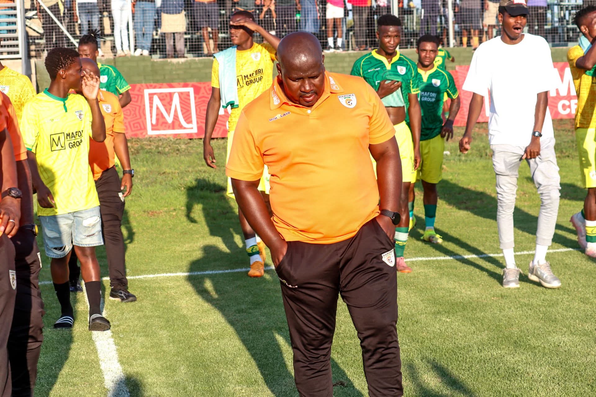 Baroka FC head coach Tlisane Motaung walking with the rest of the team at the Baroka Village in Lebowakgomo