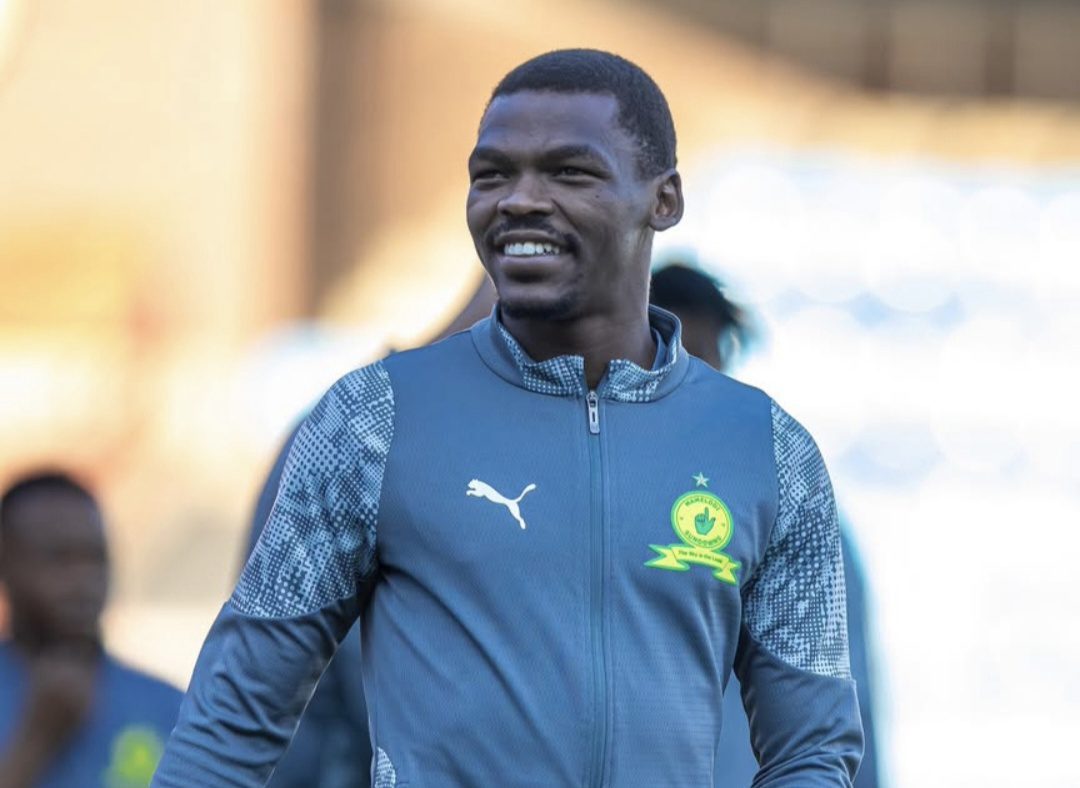 Katlego "Tsiki" Ntsabeleng doing a pitch inspection before a match 