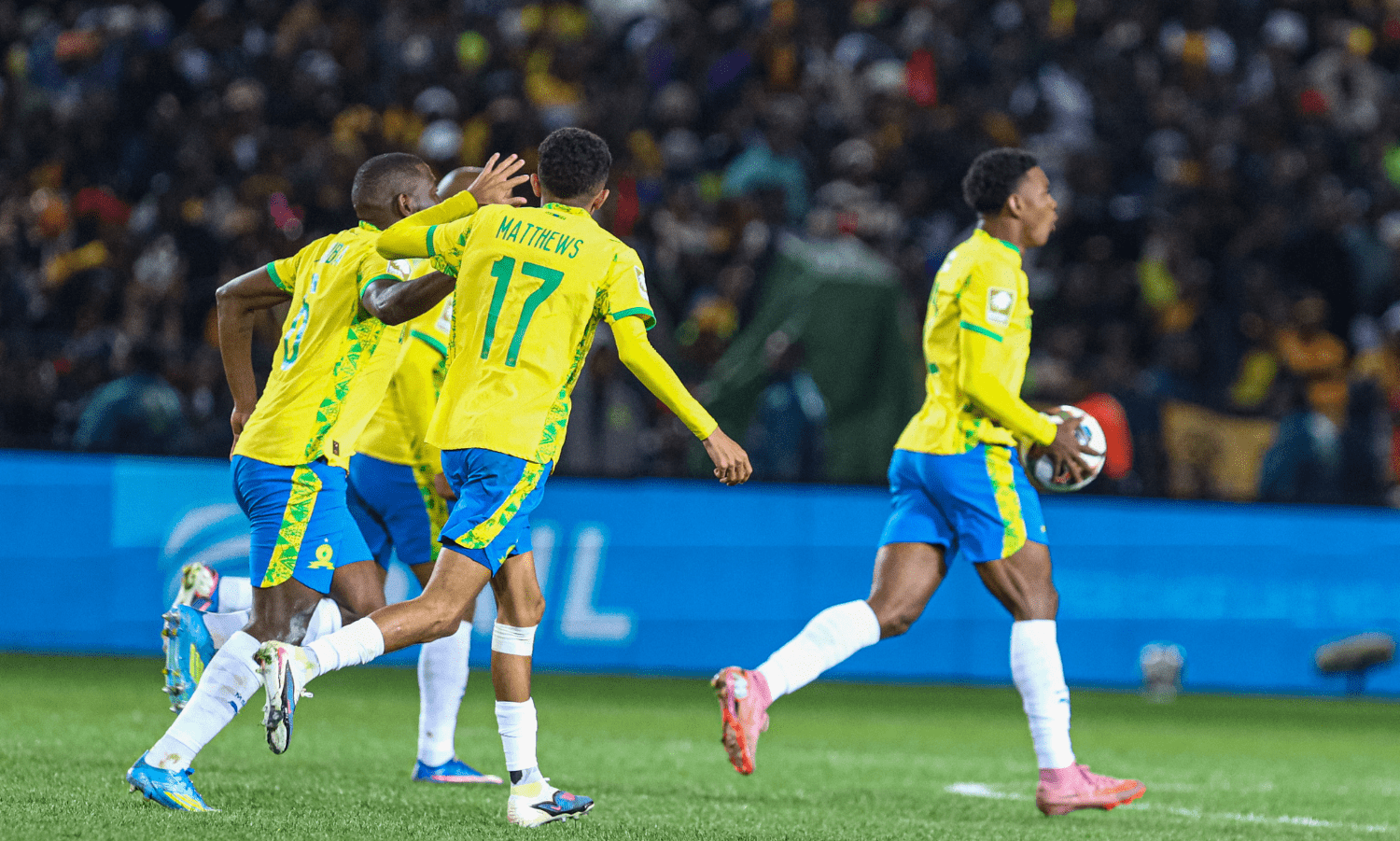 Brayan Leon celebrates after scoring and is joined by his Mamelodi Sundowns teammates