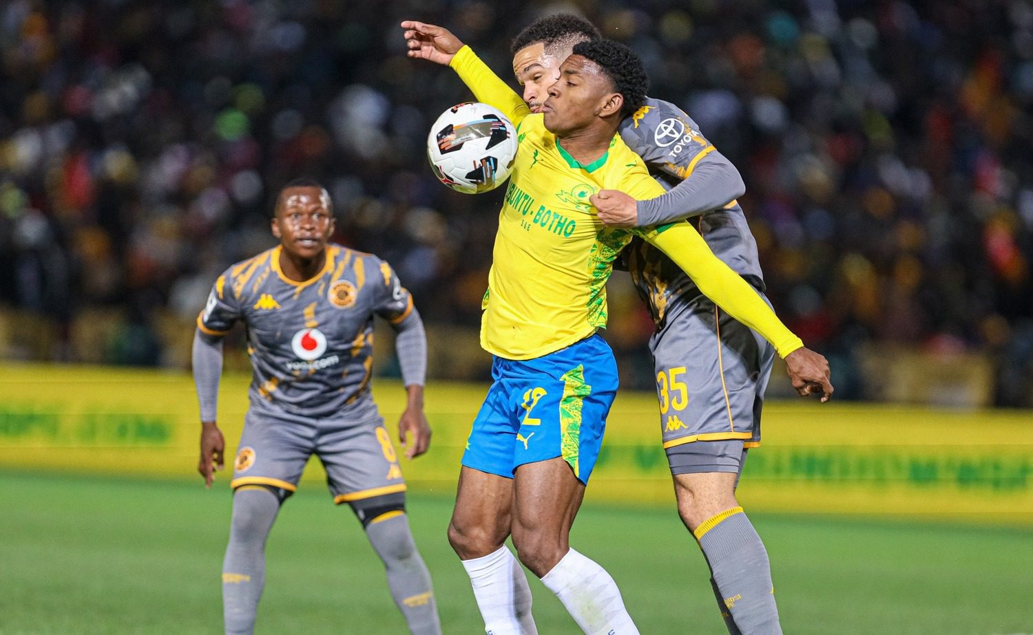 Mamelodi Sundowns striker Brayan Leon shielding the ball from Kaizer Chiefs defender Aden McCarthy as Siphesihle Ndlovu looks on
