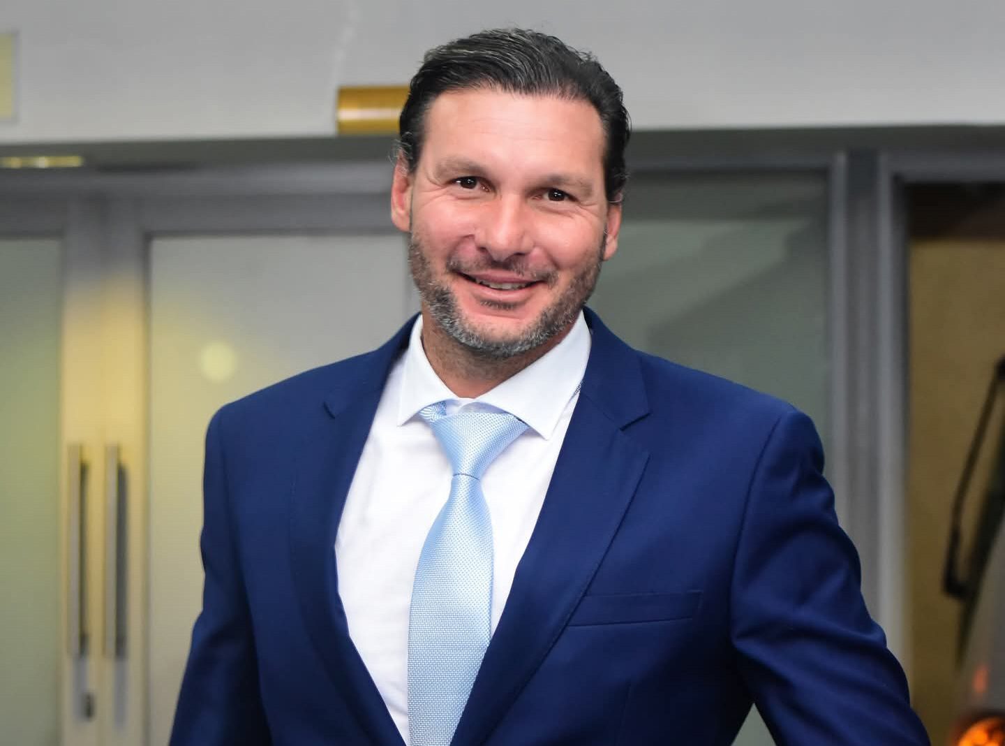 Darren Keet wearing a suit arriving at a match at the New Peter Mokaba Stadium