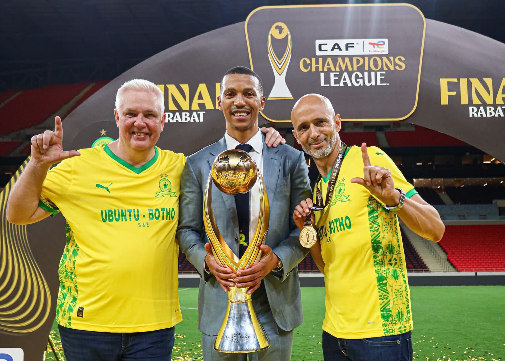 Flemming Berg, Tlhopie Motsepe and Miguel Cardoso holding a CAF Champions League trophy in Rabat 