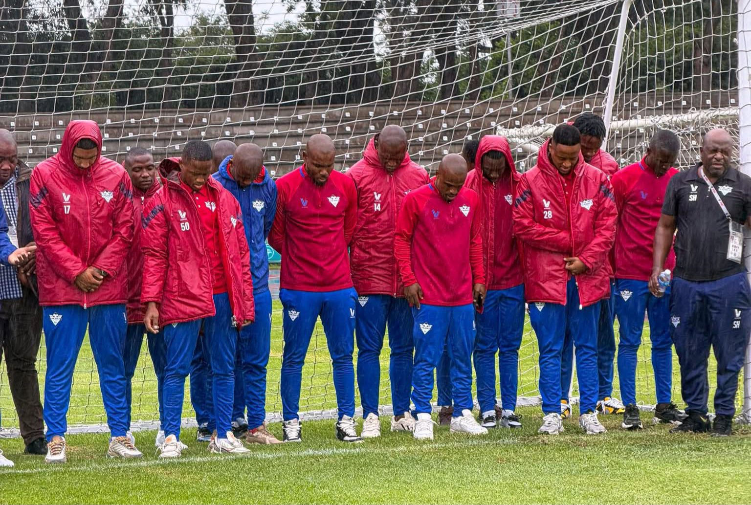 Kruger United players standing at a goal post 