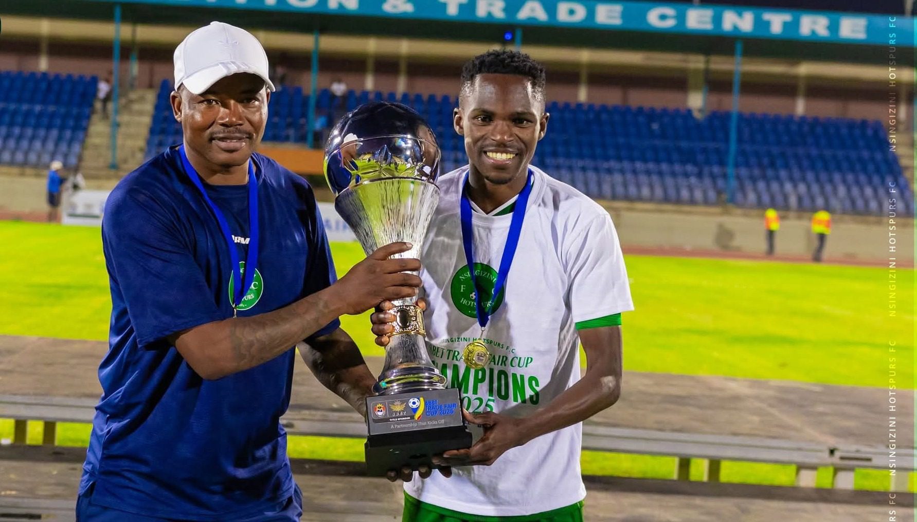 Nsingizini Hotspur FC head coach Mandla Qhogi and his player after winning 8Bet Trade Fair Cup