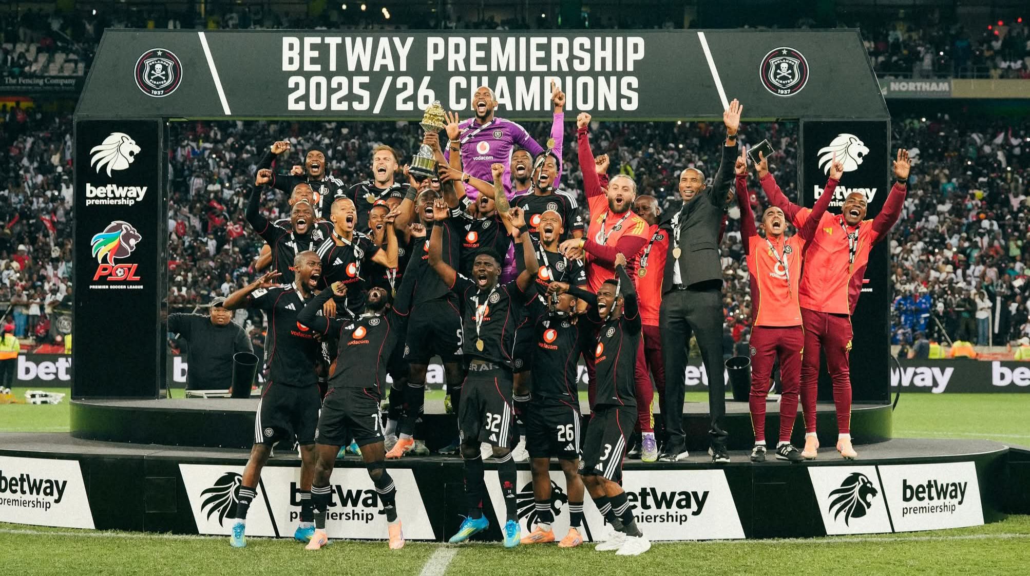Orlando Pirates players lift their Betway Premiership trophy at the Mbombela Stadium.