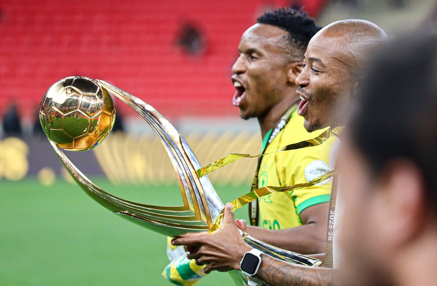Thapelo Morena with the CAF Champions League trophy alongside Mamelodi Sundowns captain Themba Zwane